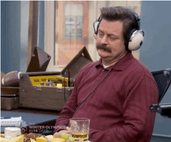 Gif of Ron Swanson from Parks & Recreation bobbing his head with a glass of scotch.